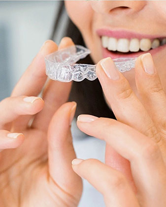 eagle woman putting in invisalign clear aligners